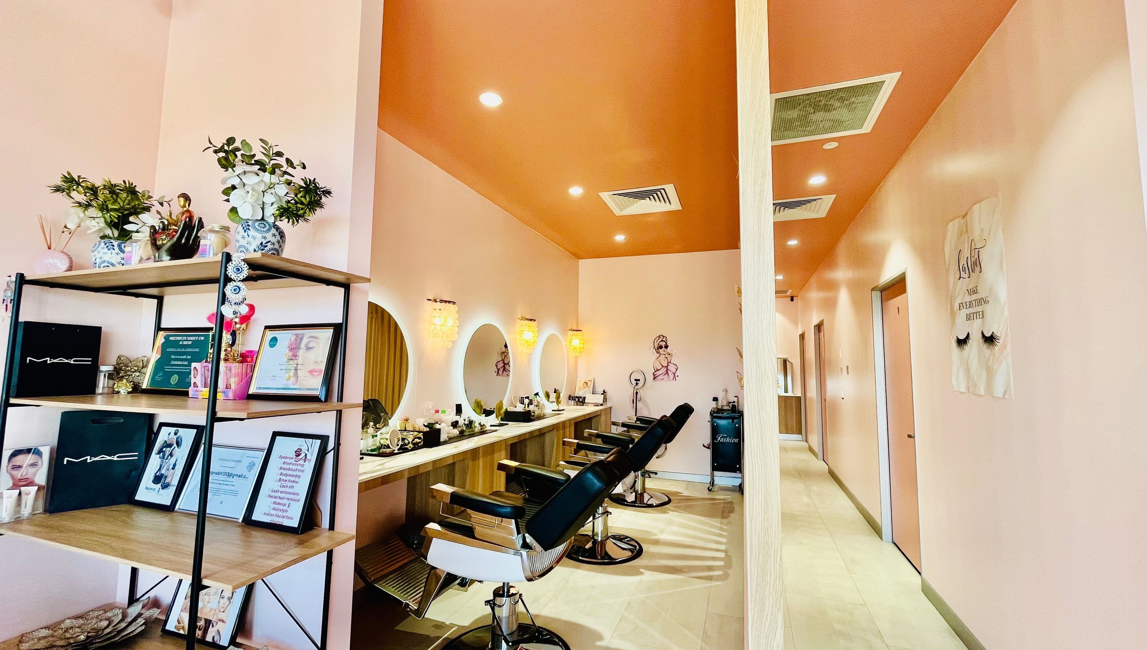 Modern salon interior at Sargis Beauty Stop, Greenbank, Queensland, AU featuring stylish chairs and mirrors.