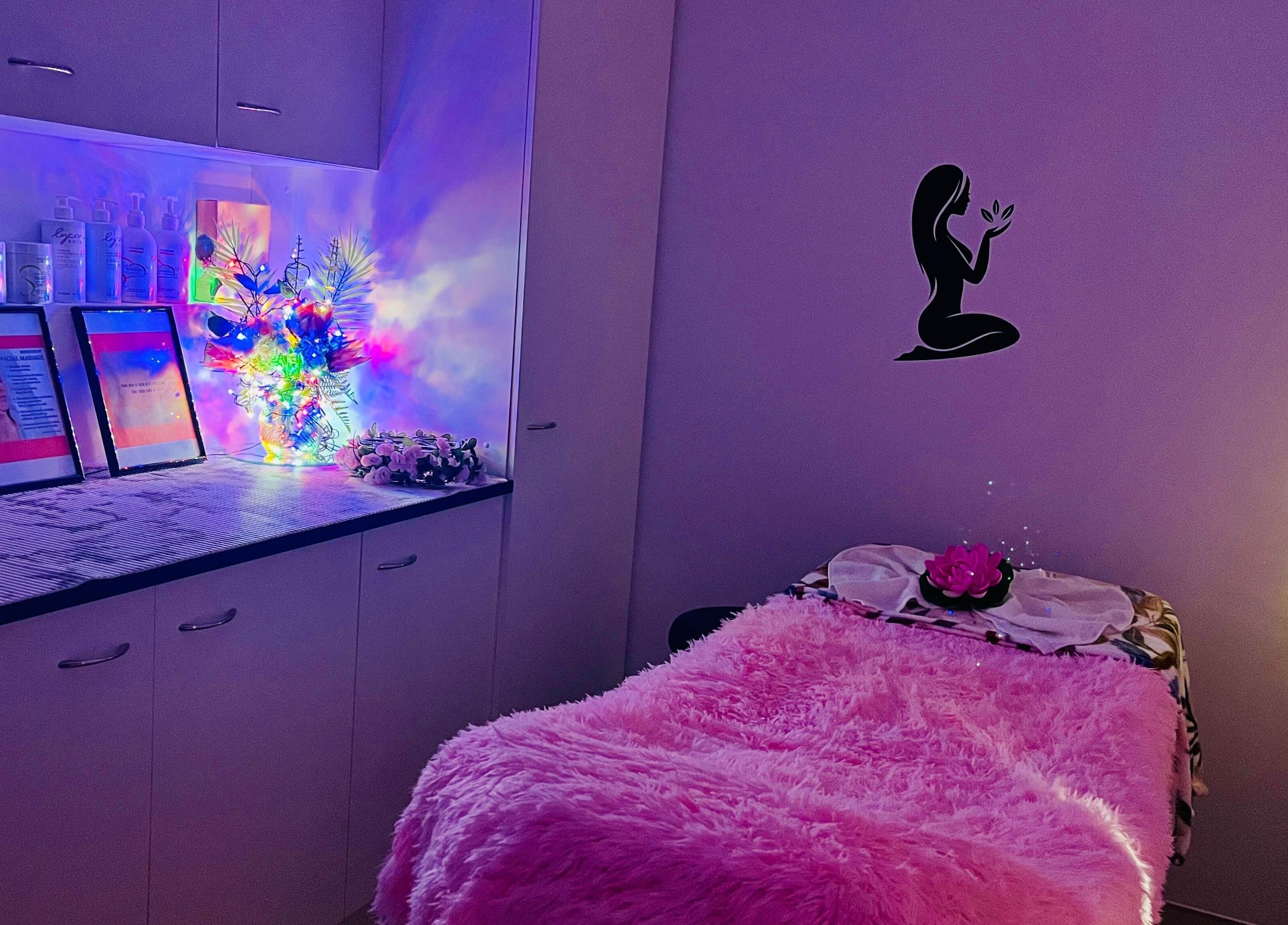 Relaxing treatment room at sargis beauty stop in Greenbank, Queensland, AU featuring plush decor and ambient lighting.