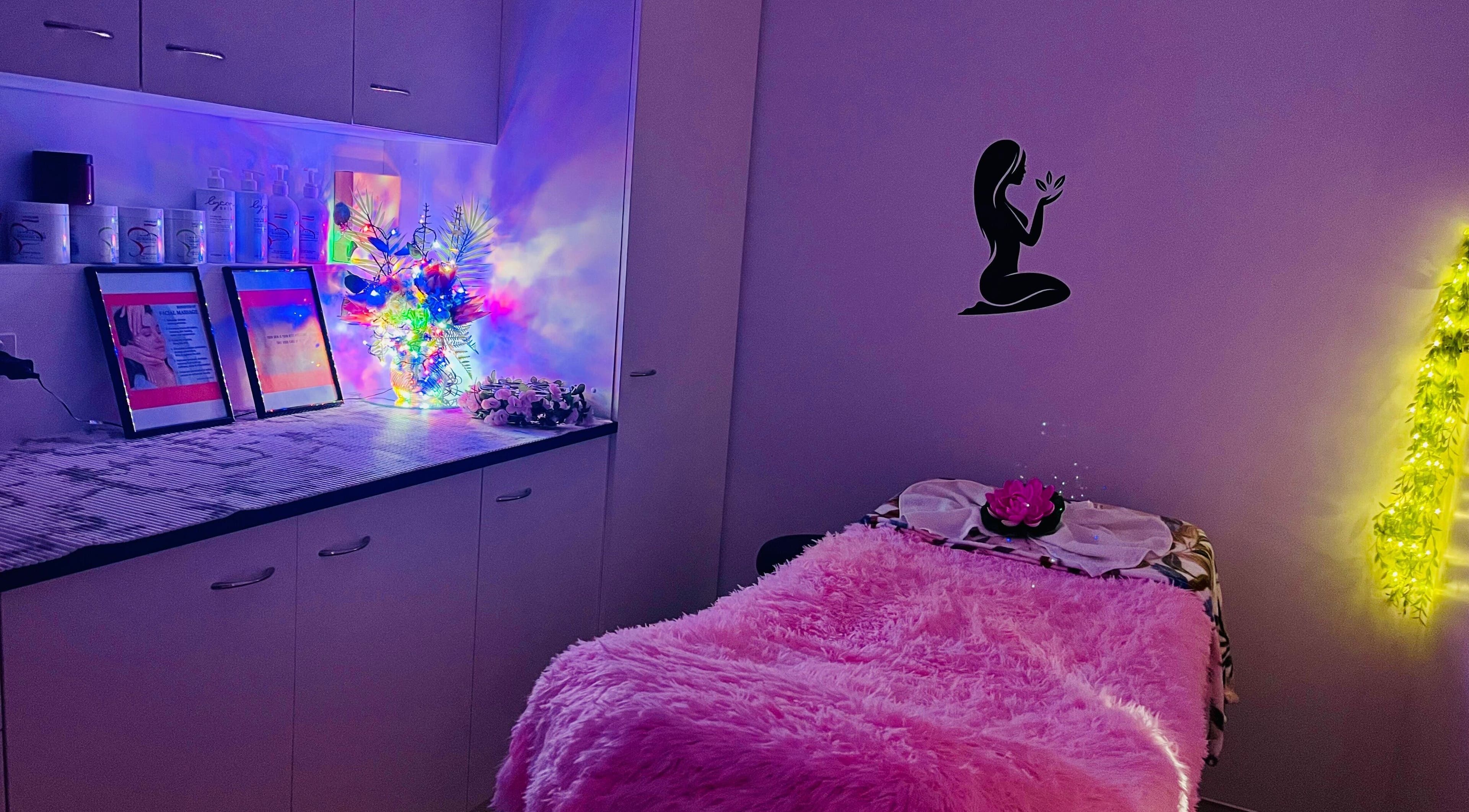 Relaxing treatment room at sargis beauty stop in Greenbank, Queensland, AU featuring plush decor and ambient lighting.