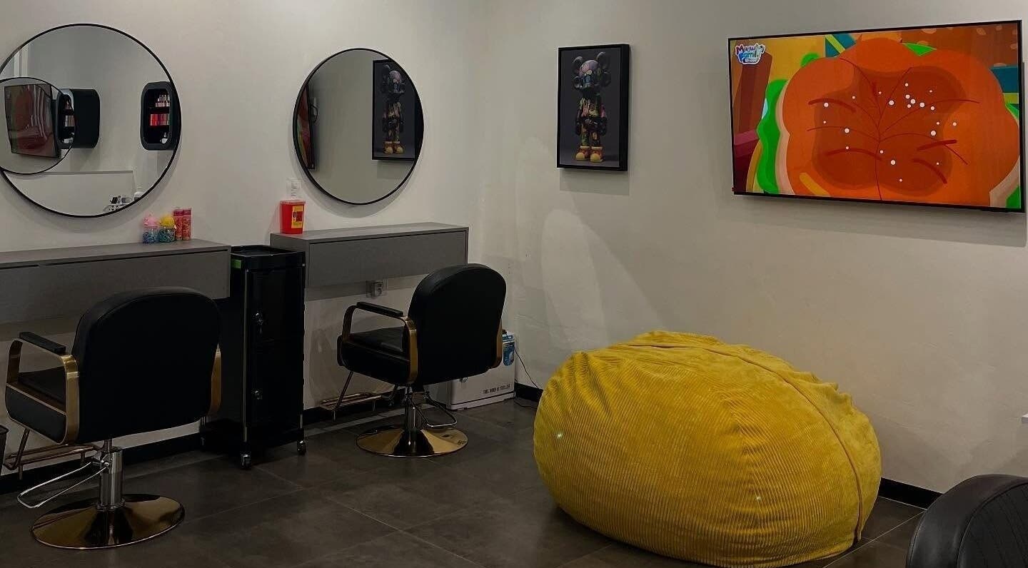 Chic salon interior at Tots And Teens, Sandton, Gauteng, ZA with modern decor and vibrant yellow bean bag.