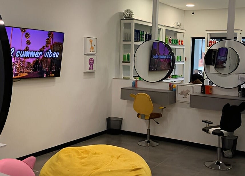 Tots And Teens, Sandton, Gauteng, ZA: Modern salon with colorful décor and stylish seating for kids.