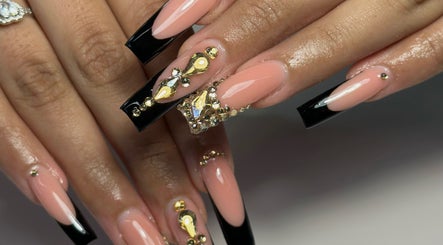 Elegant nail art with jewels at Nailsby.Jona, Coventry, England, GB. Sophisticated black and nude design.