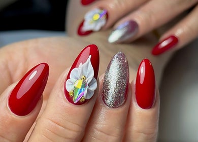 Stunning red nails with floral and glitter accents at Nailsby.Jona, Coventry, England, GB.