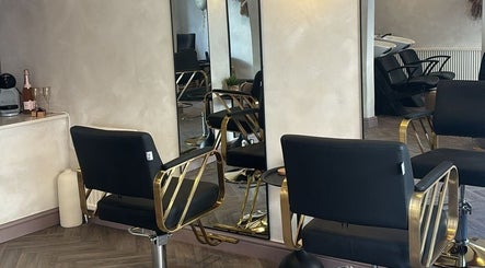 Chic salon chairs and mirrors at Jordon at Amica Hair & Beauty in Thirsk, England, GB.