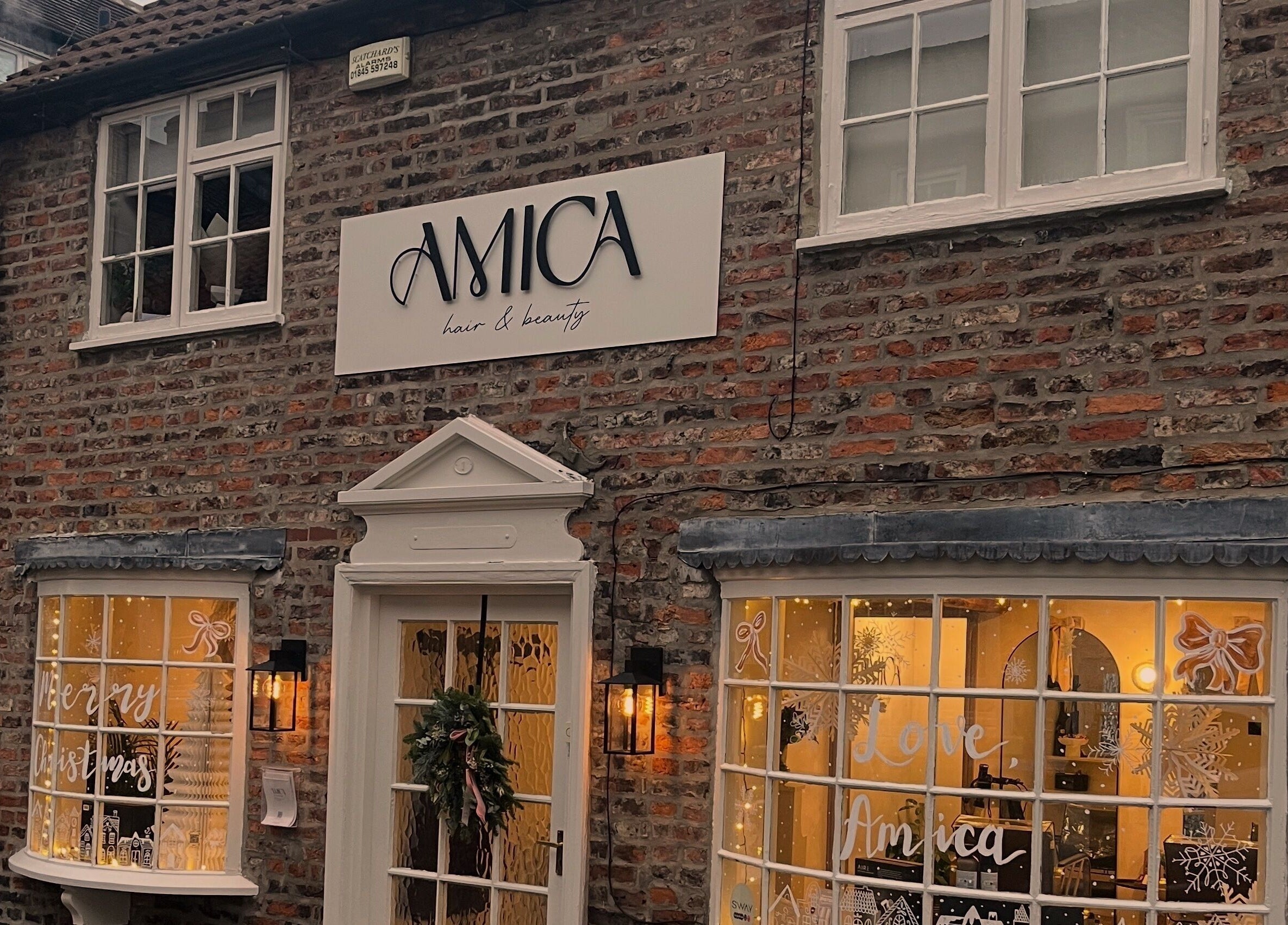 Jordon at Amica Hair & Beauty's inviting exterior in Thirsk, England, GB, decorated seasonally.
