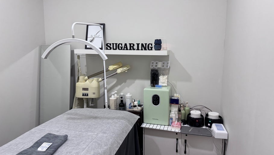 Sugaring Beaute Studio's serene room in Johor Bahru, Johor Darul Ta'zim, MY, with a cozy massage table.