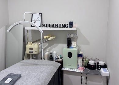 Sugaring Beaute Studio's serene room in Johor Bahru, Johor Darul Ta'zim, MY, with a cozy massage table.
