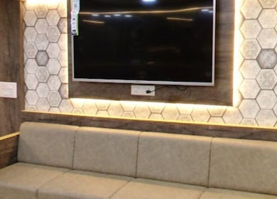 Elegant lounge area in Eklipz Men's Salon - Rajkot, featuring a cozy couch and modern decor. Rajkot, Gujarat, IN.