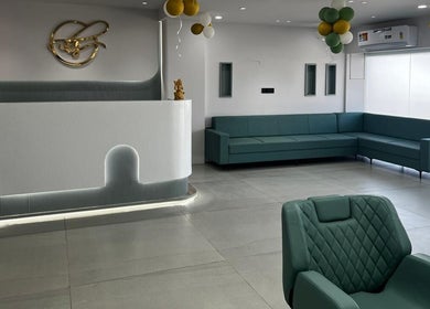 Elegant waiting area at Eklipz Ladies Salon - Morbi with teal sofas in Morbi, Gujarat, IN.