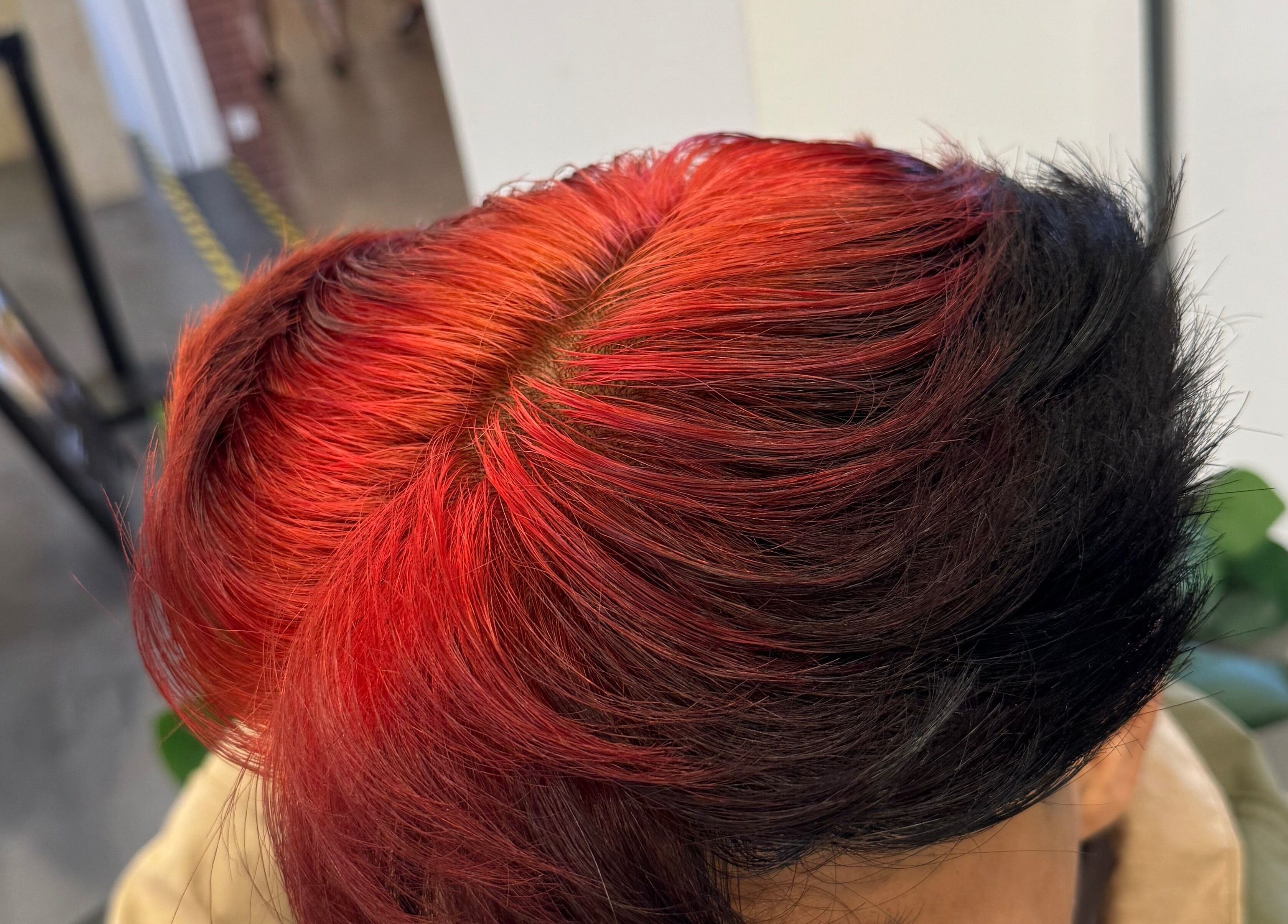 Dynamic red and black hair coloring at TRYM, Tanjung Kling, Malacca, MY showcasing bold style.