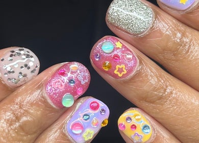 Colorful celestial nail art at Mani’s By Mys, Dunedin, Otago, NZ offering unique and creative designs.
