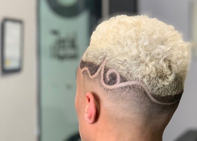 Intricate haircut design with blonde curls at FadedT0Glory, Kennewick, Washington, US.