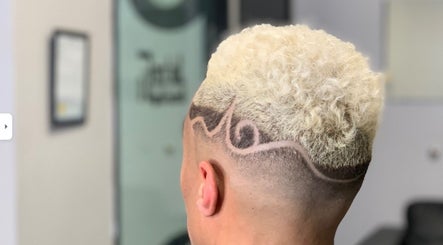 Intricate haircut design with blonde curls at FadedT0Glory, Kennewick, Washington, US.