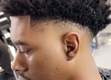 Close-up of a fresh fade haircut at FadedT0Glory, Kennewick, Washington, US, showcasing precision styling.