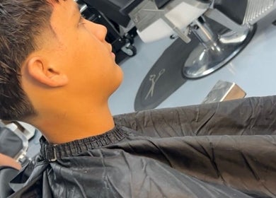 Haircut in progress at FadedT0Glory, Kennewick, Washington, US, showcasing a sleek, modern fade.