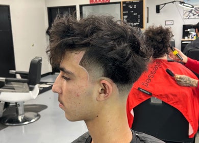 Trendy haircut at FadedT0Glory in Kennewick, Washington, US enhancing modern style for young men.