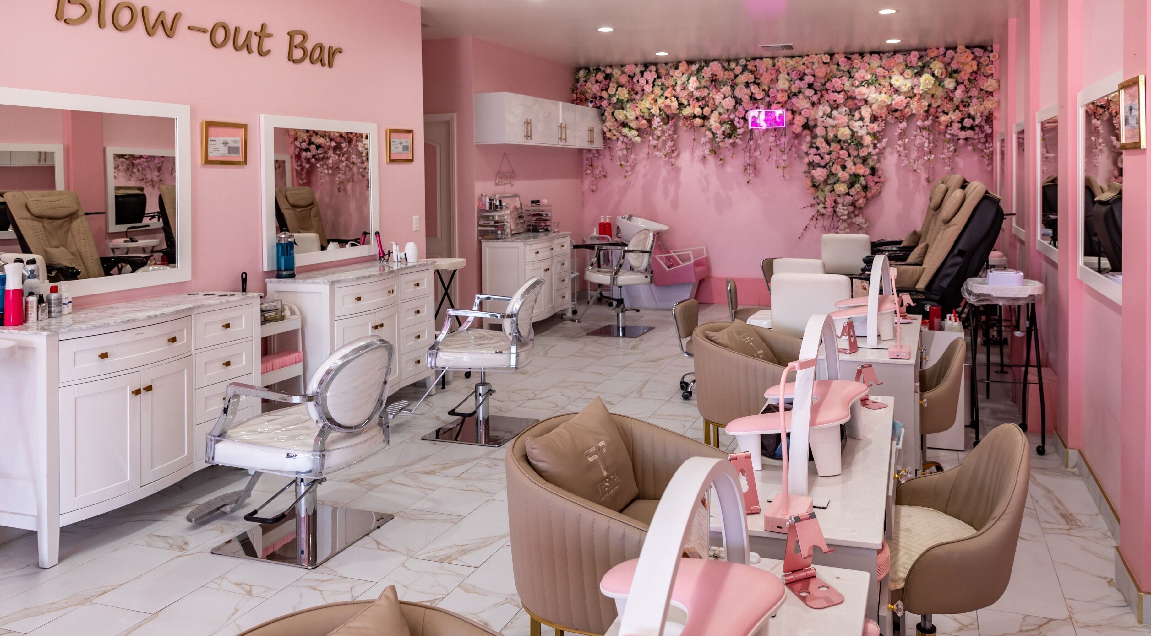 Chic interior of Fara’s beauty lounge in Glendale, California, US, featuring plush chairs and floral decor.