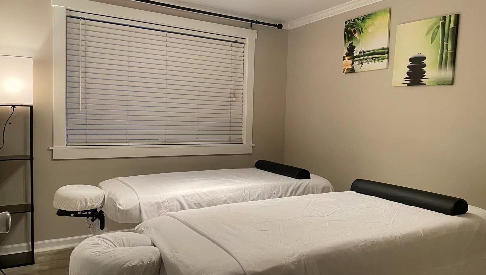 Tranquil massage room at S&C Wellness Spa, Everett, Washington, US, with two massage tables.