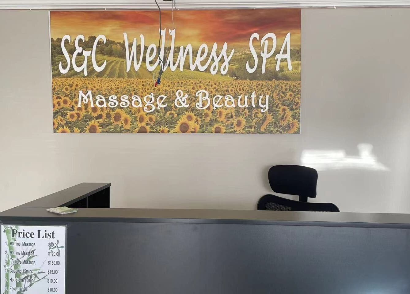 Reception desk at S&C Wellness Spa in Everett, Washington, US with sunflower artwork and a price list.