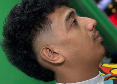 Side profile of chic fade haircut at SNEAKYSNIPS BARBERSHOP, Johor Bahru, Johor Darul Ta'zim, MY.