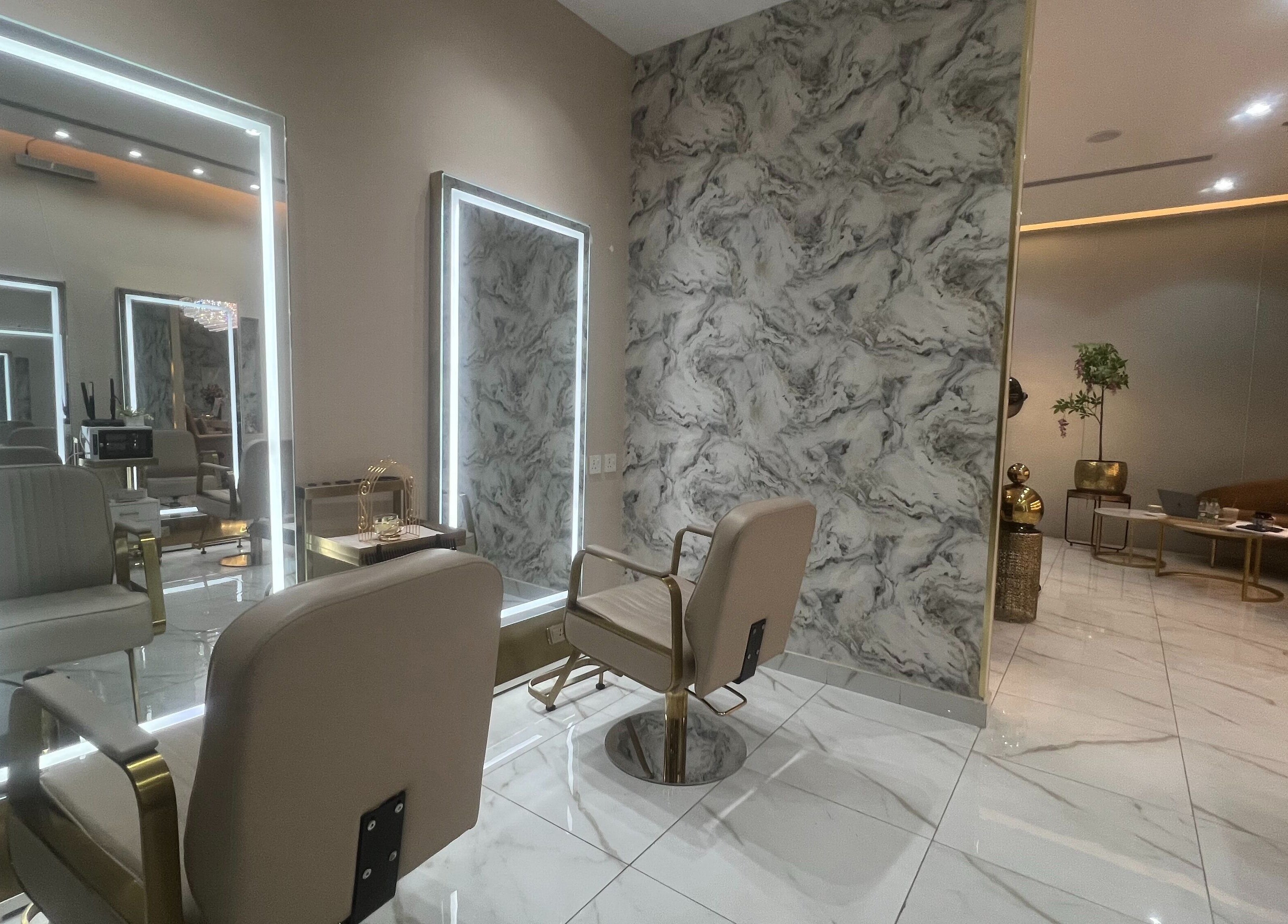 Modern styling station at Wejdan Aljamal Beauty Salon, Dhahran, Eastern Province, SA with elegant seating.