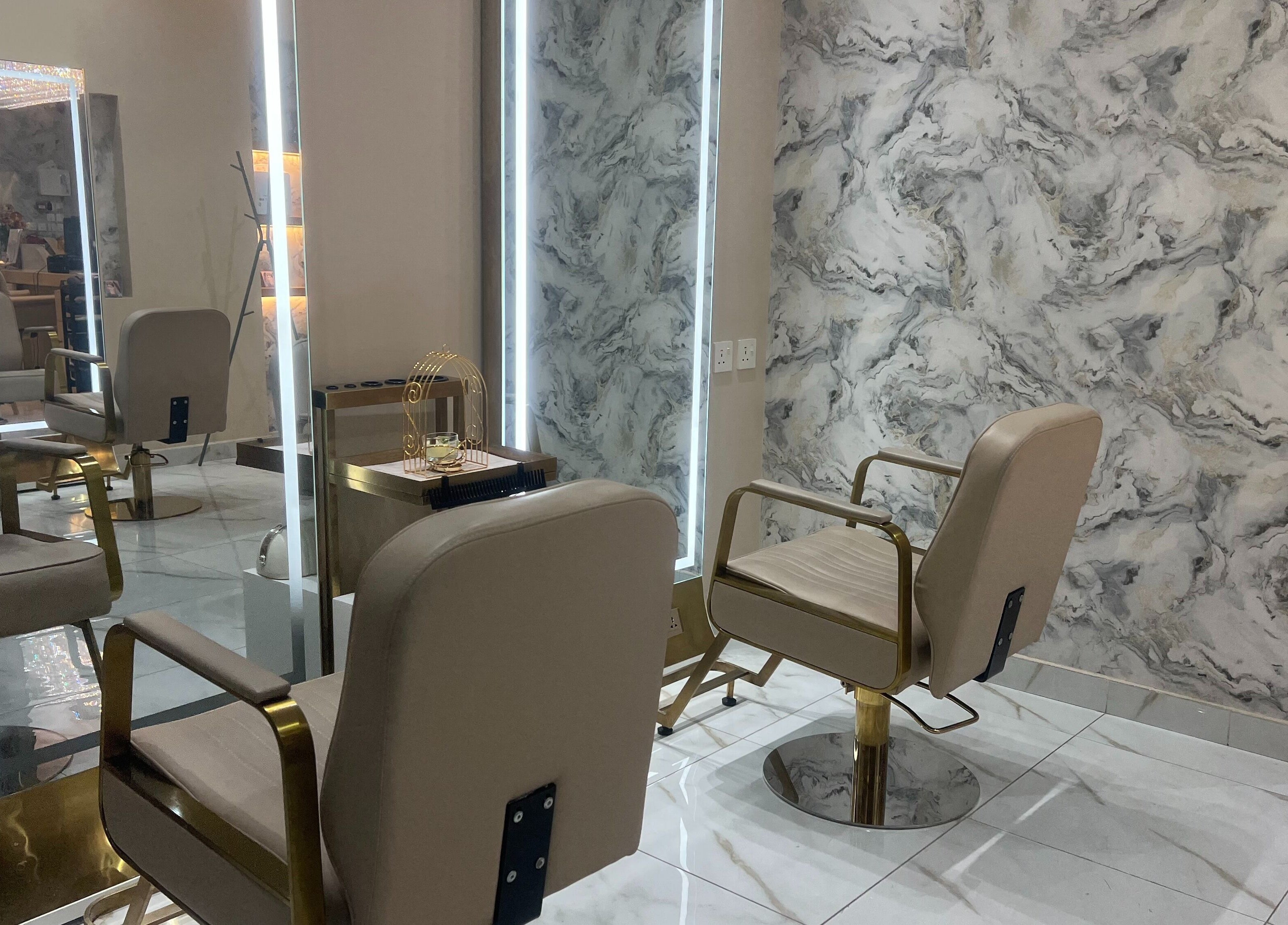 Elegant seating area of Wejdan Aljamal Beauty Salon in Dhahran, Eastern Province, SA with stylish decor.