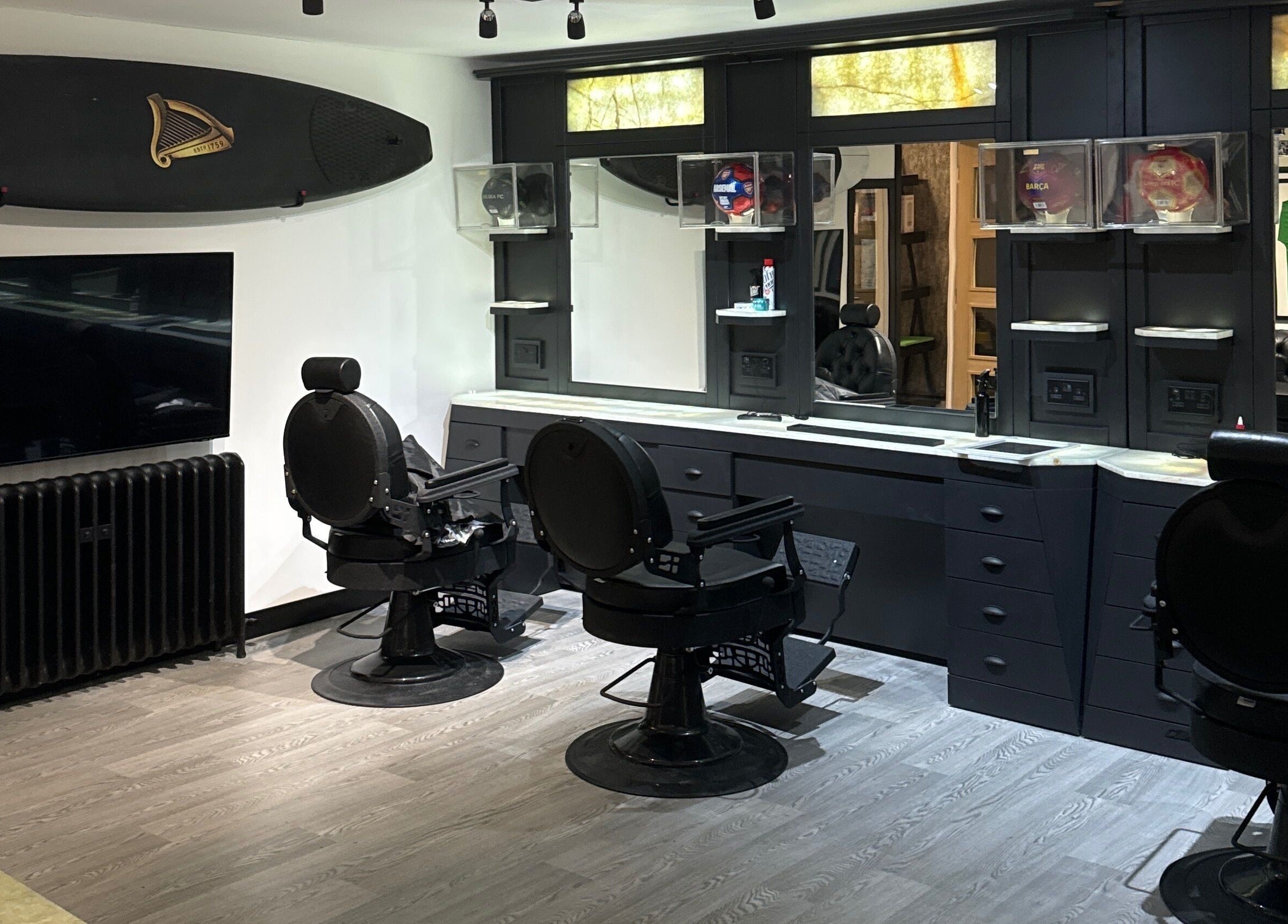Elegant barber chairs and mirrors at The Barber Lounge, Kirkintilloch, Scotland, GB.