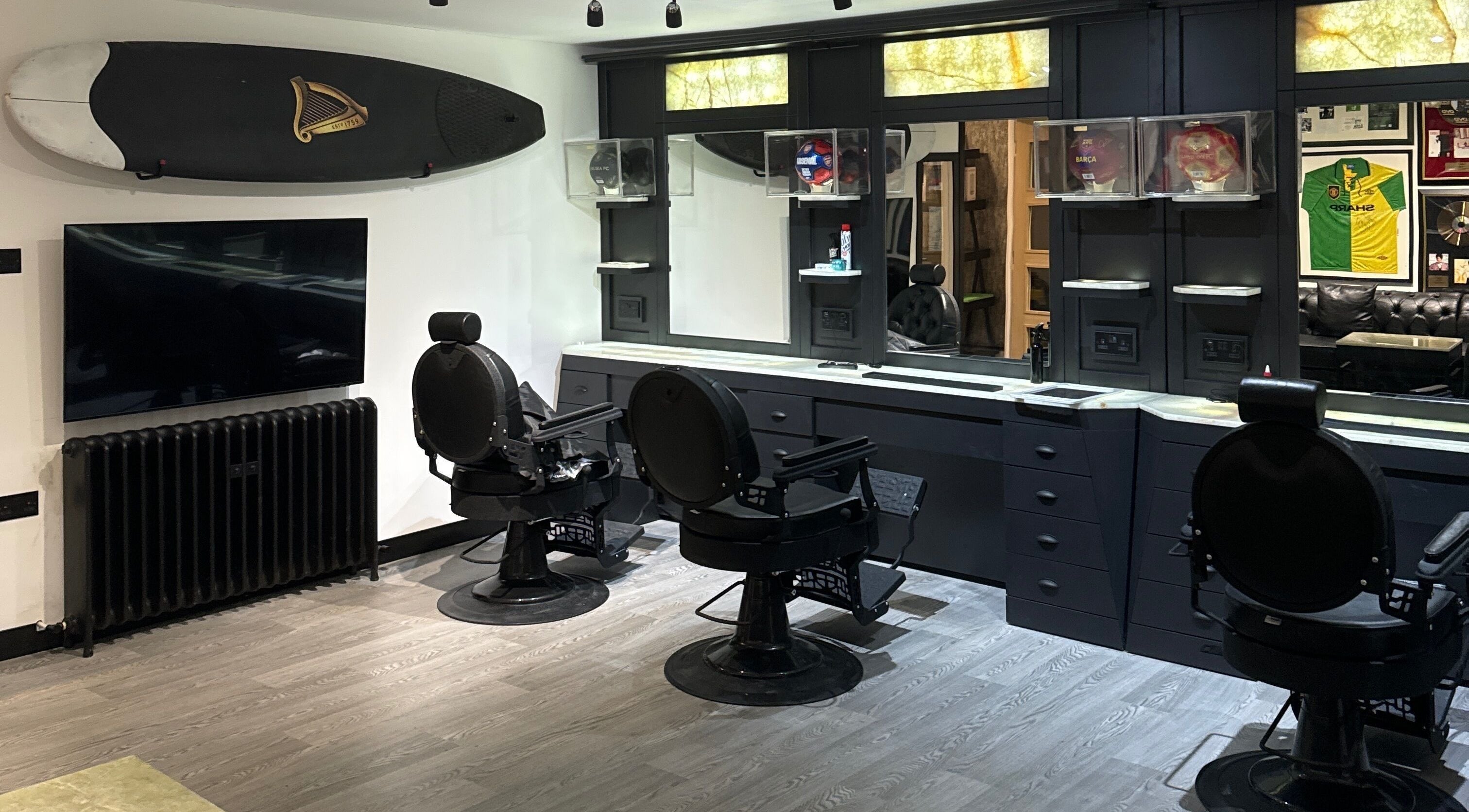 Elegant barber chairs and mirrors at The Barber Lounge, Kirkintilloch, Scotland, GB.