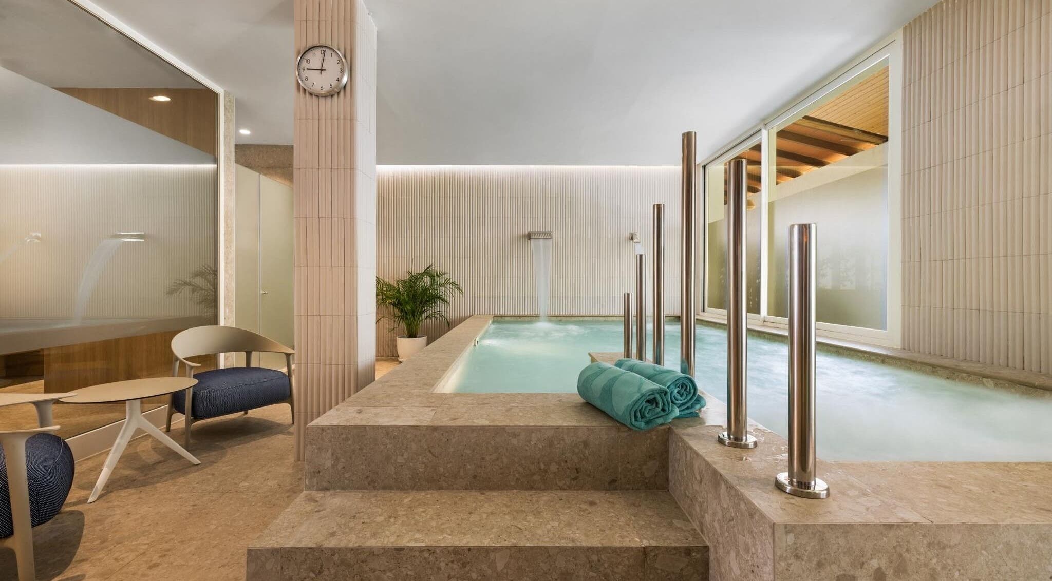 Relaxing spa area with a pool at SPA VIVA Sunrise in Alcúdia, Illes Balears, ES, featuring soothing decor.