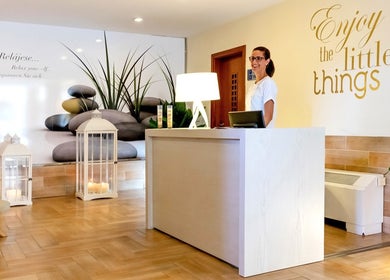 Reception at Spa Viva Blue & Spa, Illes Balears with welcoming decor and smiling staff.