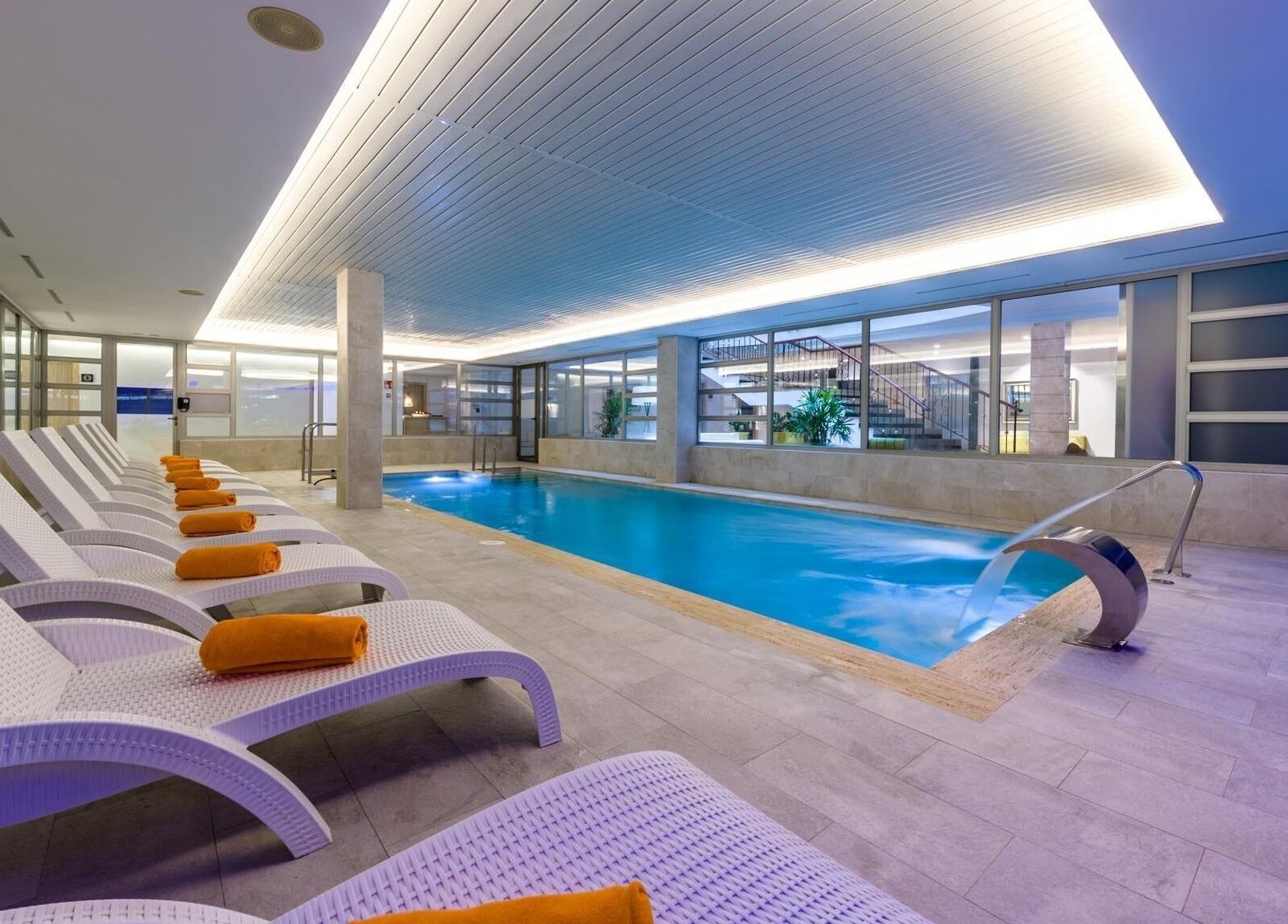 Relaxing indoor pool at SPA VIVA Cala Mesquida Resort & Spa, Cala Mesquida, Illes Balears, ES with lounge chairs.