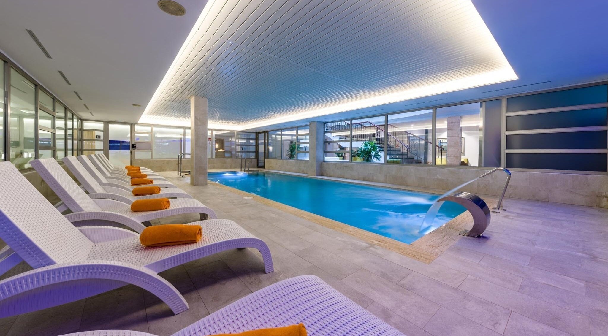 Relaxing indoor pool at SPA VIVA Cala Mesquida Resort & Spa, Cala Mesquida, Illes Balears, ES with lounge chairs.