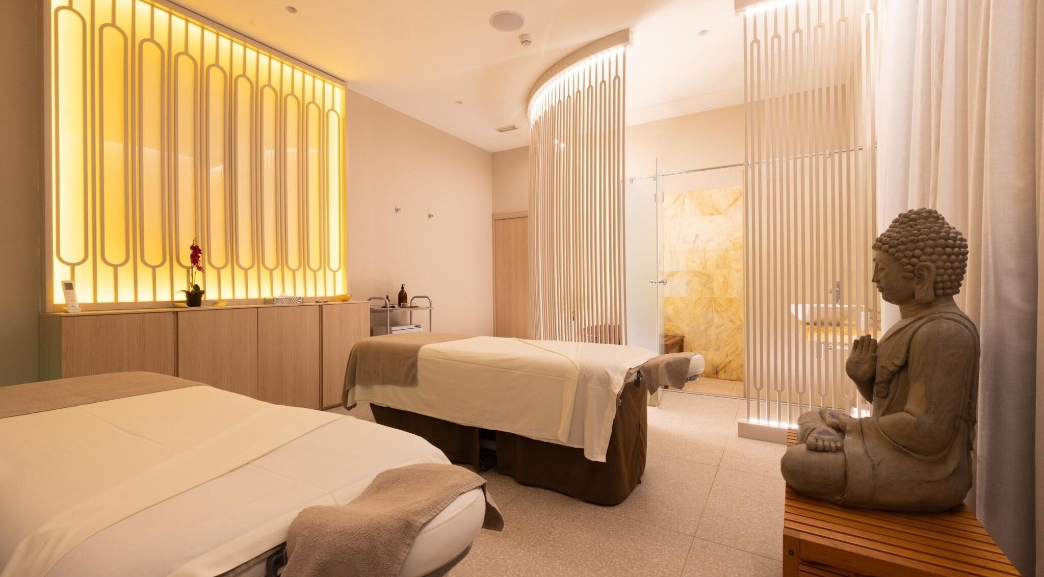 Tranquil spa room with Buddha statue at Spa Viva Cala Mesquida Suites, Cala Mesquida, Illes Balears, ES.