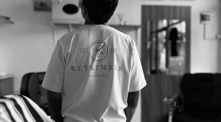 Back view of a person in Rey Kimber Barbershop uniform in Bali, Bali, ID.