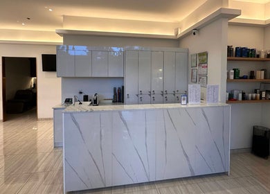 Sophisticated reception area of Salon de Buti in Taguig, Metro Manila, PH with marble counter and sleek design.