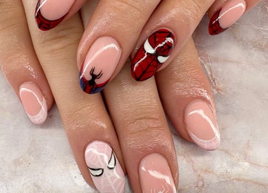 Stylish superhero nail art at Belle Luxe Beauty, Crowthorne, England, GB, featuring bold comic designs.