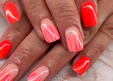 Vibrant orange gel nails with artistic design at Belle Luxe Beauty, Crowthorne, England, GB.