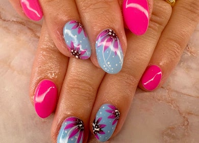 Beautiful floral nail art at Belle Luxe Beauty, Crowthorne, England, GB. Bright colors and elegant design.