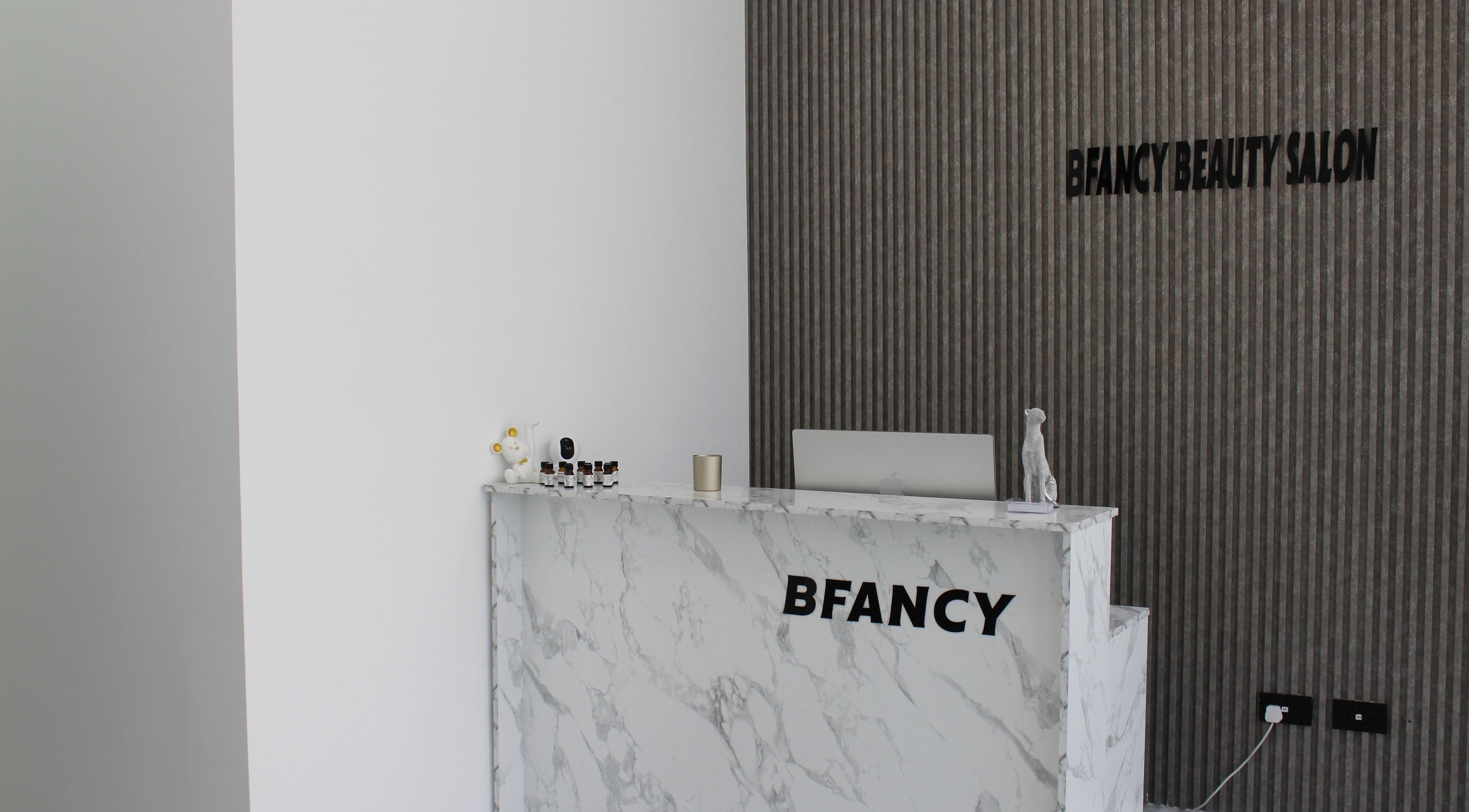 Reception area at Bfancy Beauty Salon, Dubai, Dubai, AE with modern decor and marble counter.