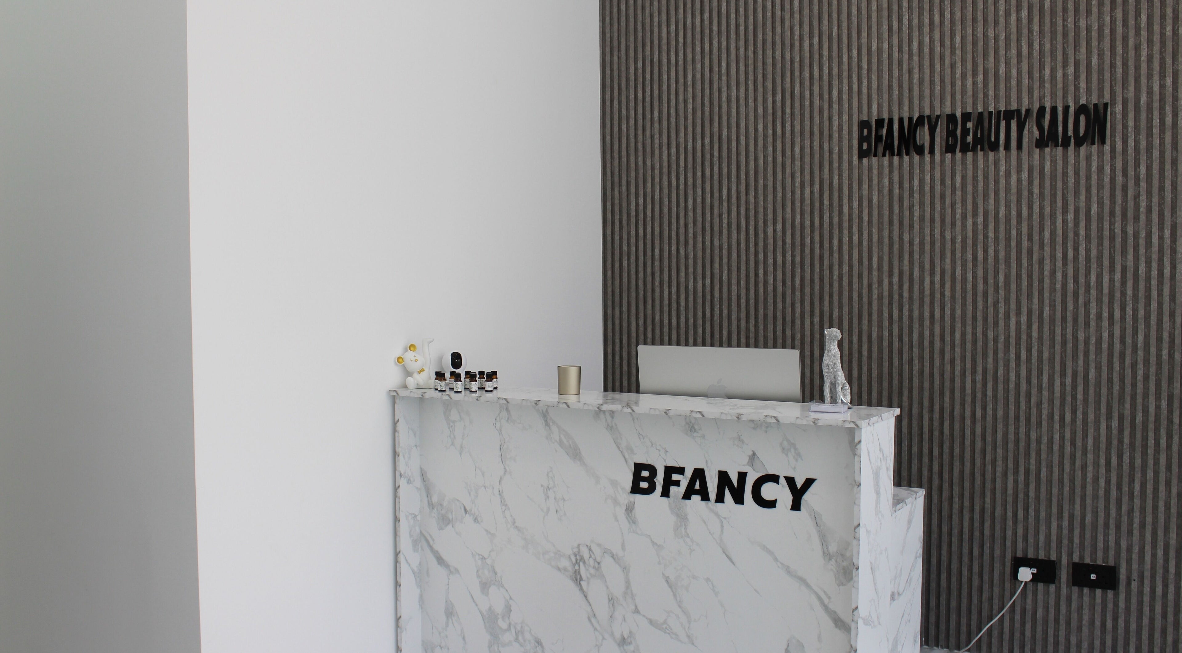 Reception area at Bfancy Beauty Salon, Dubai, Dubai, AE with modern decor and marble counter.