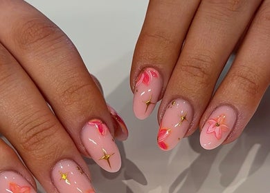 Floral nail art design at Nails By Alice B - Newcastle, Stoke-on-Trent, England, GB, showcasing pink and gold hues.