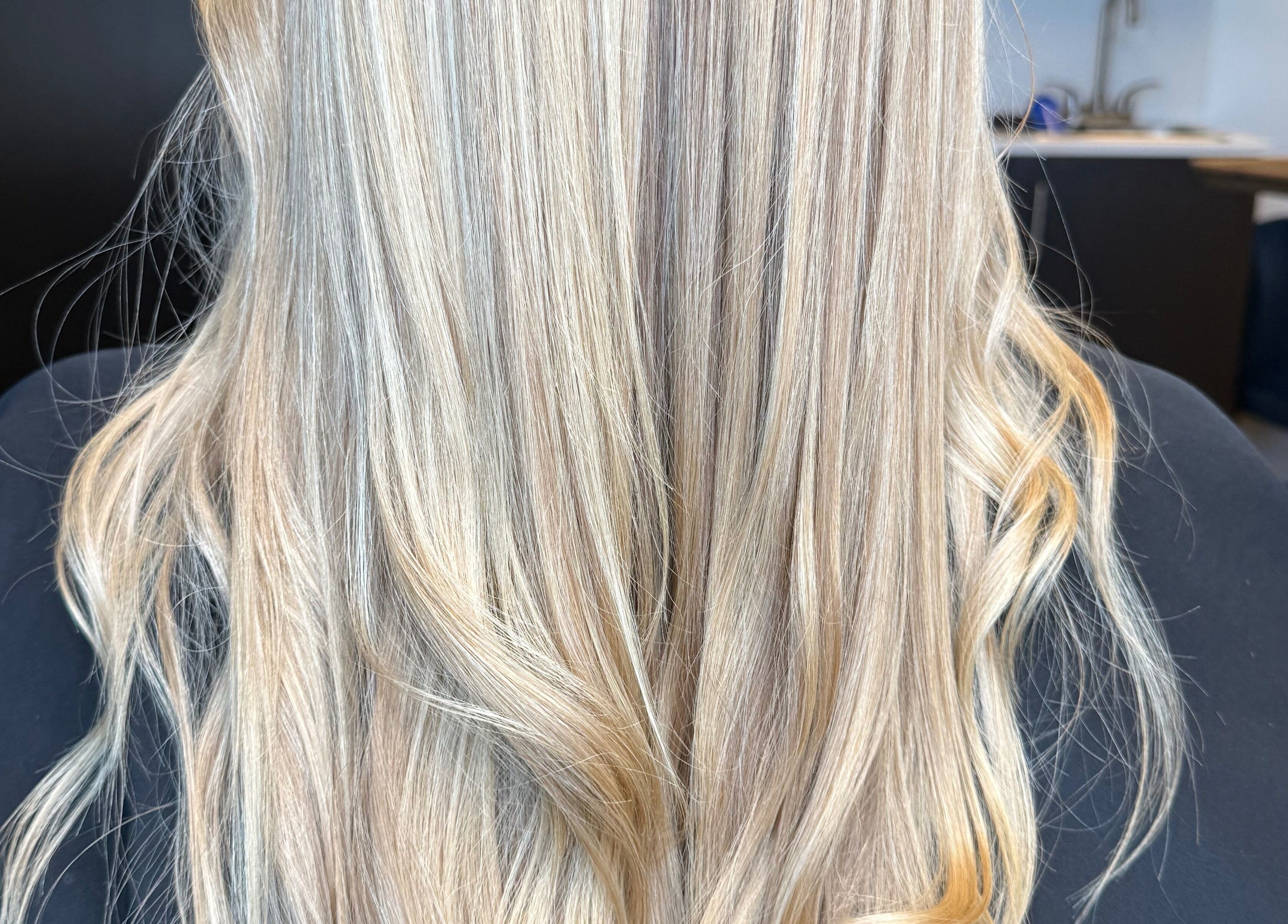 Blonde wavy hair styled at Brianne Rae Styles in Smithtown, New York, US.