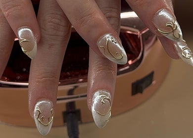 Elegant gold-accented nails at Buttercup Nails, North Lakes, Queensland, AU showcase intricate nail artistry.
