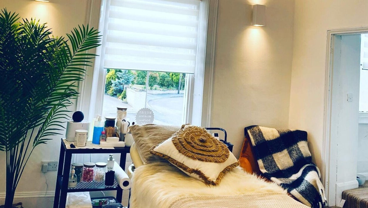 Relaxing treatment room at The Lavender Lounge, Carlton In Lindrick, England, GB with cozy pillows and soft lighting.