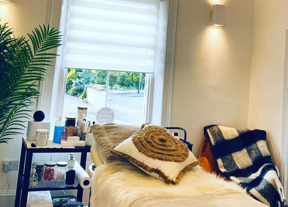 Relaxing treatment room at The Lavender Lounge, Carlton In Lindrick, England, GB with cozy pillows and soft lighting.