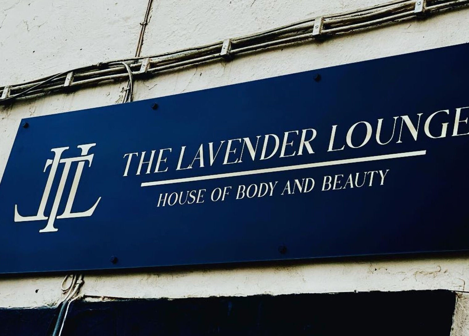 The Lavender Lounge sign at Carlton In Lindrick, England, GB, showcasing beauty and wellness services.