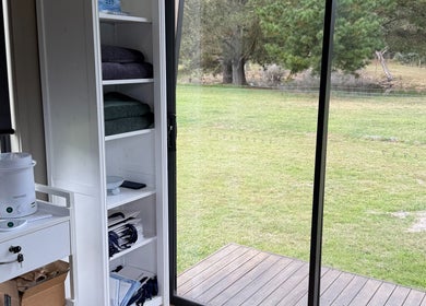 Bright spa interior at Always Natural Beauty in Longford, Victoria, AU, overlooking a tranquil green landscape.