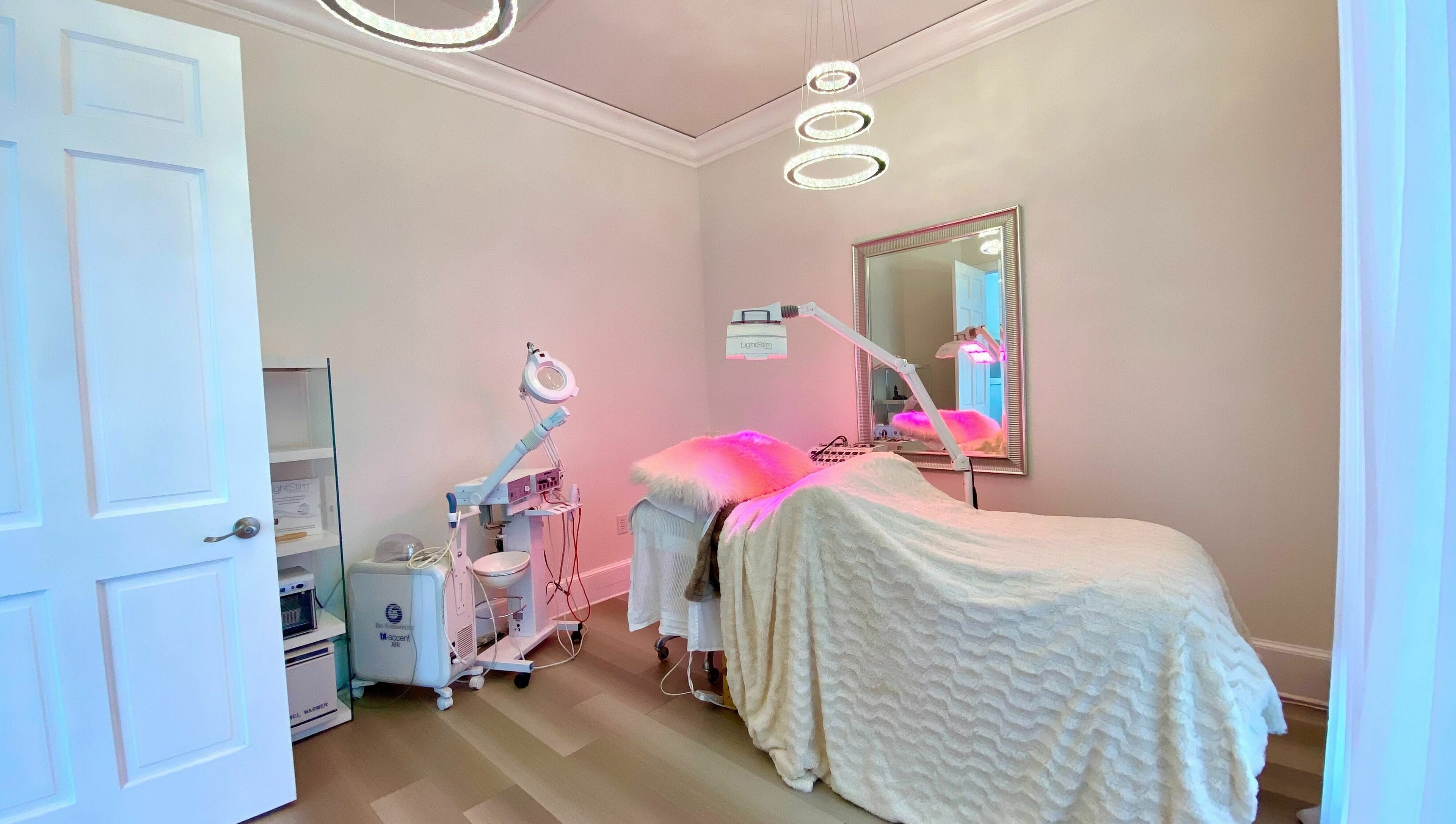 Treatment room at ReVive Spa Charlotte, in Charlotte, North Carolina, US, featuring cozy linens and modern equipment.