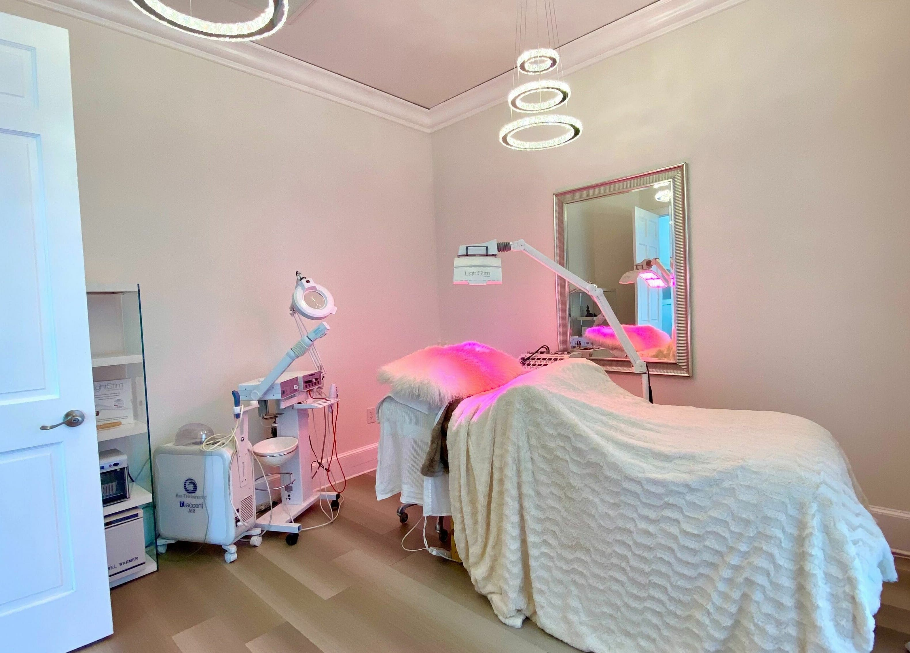 Treatment room at ReVive Spa Charlotte, in Charlotte, North Carolina, US, featuring cozy linens and modern equipment.