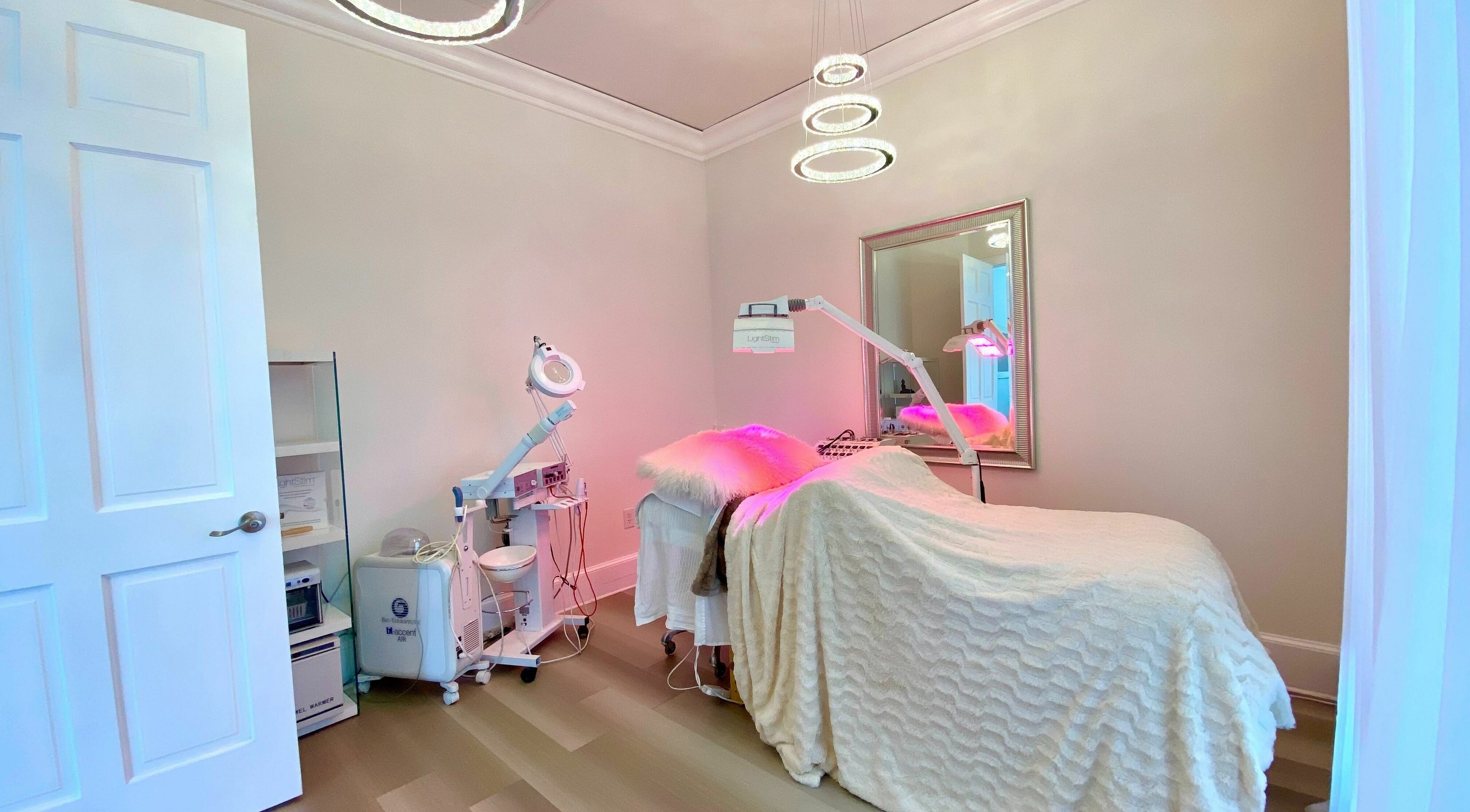Treatment room at ReVive Spa Charlotte, in Charlotte, North Carolina, US, featuring cozy linens and modern equipment.